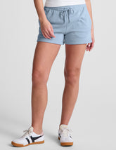 blue mid rise sweat shorts with a 3.5" inseam and pockets.